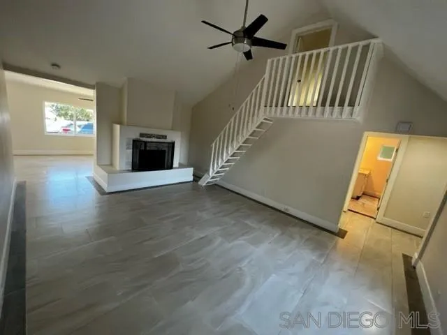 26945 Valley Center Road Valley Center, CA 92082 - Photo 5 of 17 a view of a livingroom with wooden floor and a ceiling fan