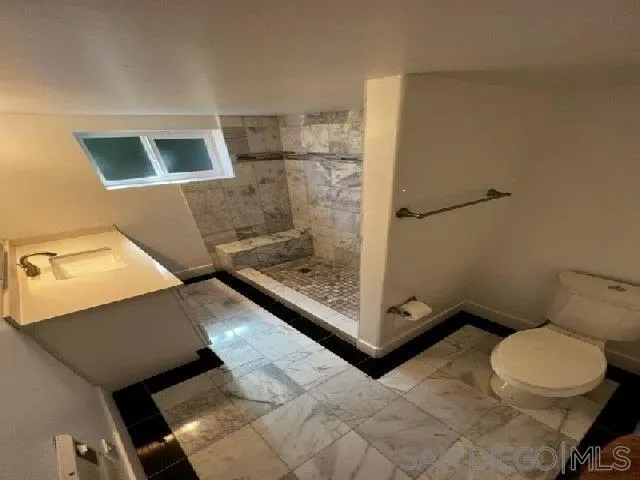 26945 Valley Center Road Valley Center, CA 92082 - Photo 8 of 17 a bathroom with a toilet and a shower