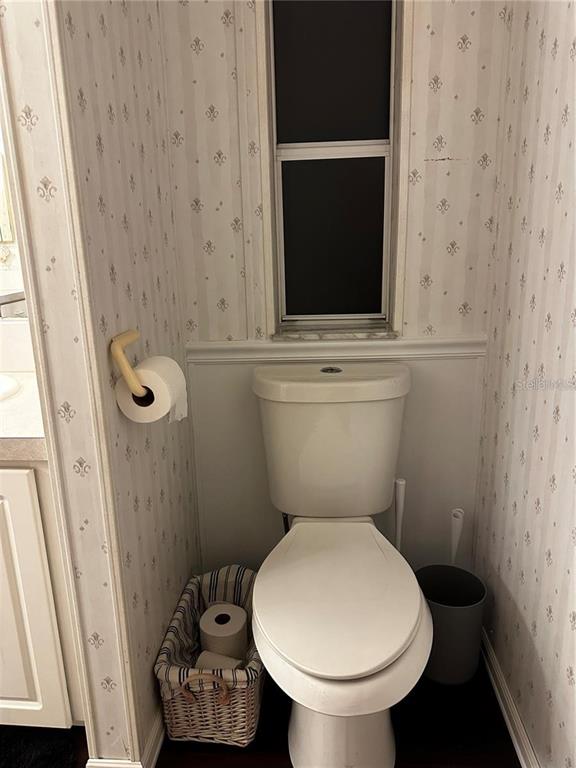 1100 South Belcher Road, Unit 406 Largo, FL 33771 - Photo 15 of 46 a bathroom with a toilet and a sink