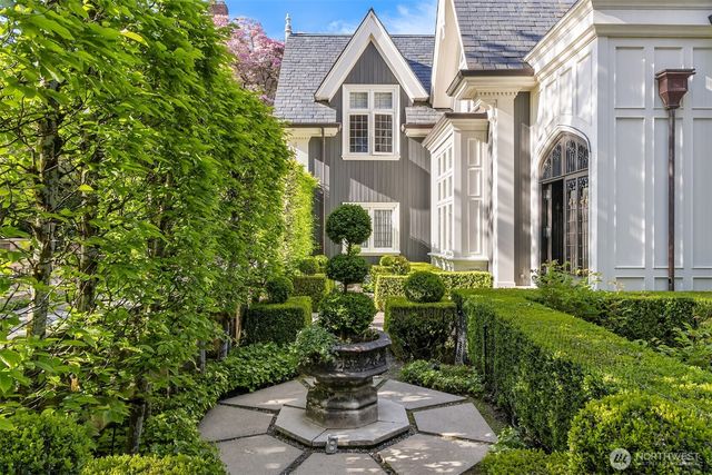 a view of a house with potted plants