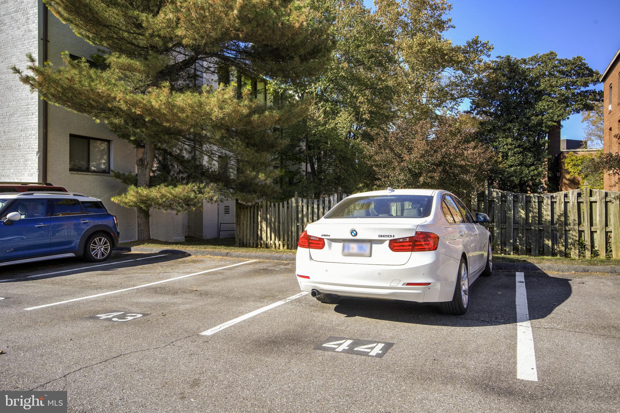2610 Tunlaw Road Northwest, Unit 104 Washington, DC 20007 - Photo 18 of 20 a white car parked in front of a house