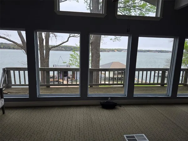 a view of a porch with two windows