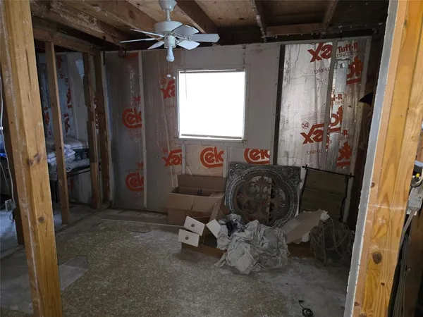 a bedroom with a bed and a table