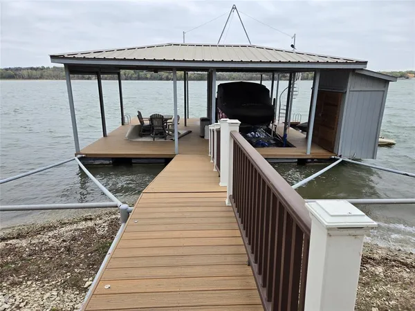 a view of a balcony with furniture and wooden floor