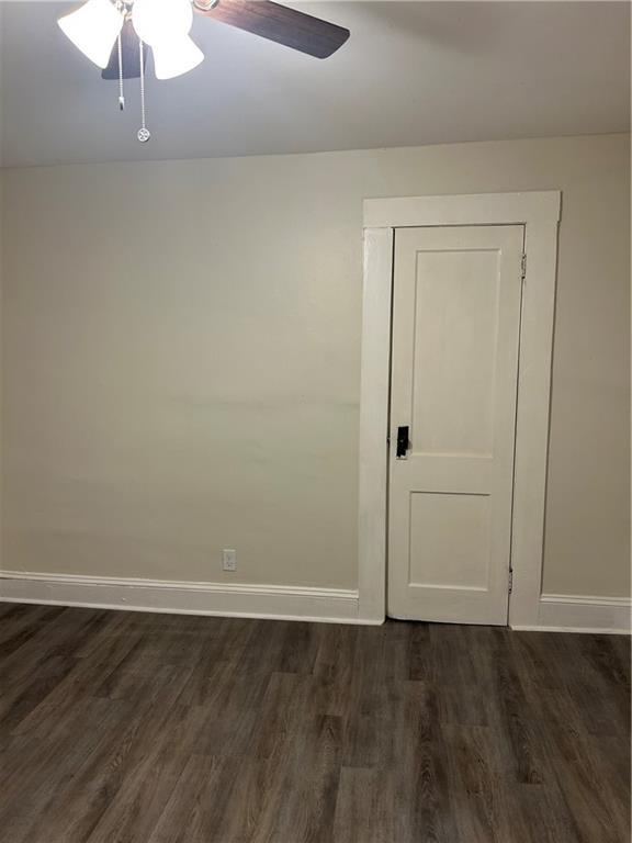 180 Harlan Road Southwest Atlanta, GA 30311 - Photo 19 of 20 a view of an empty room with wooden floor and closet