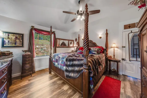 a view of a house with a backyard and a tree