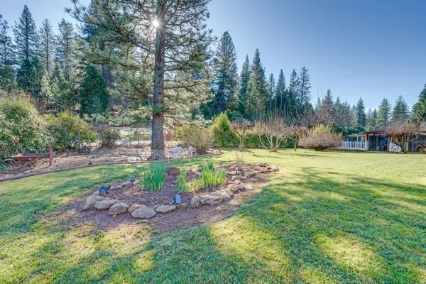 a view of a house with a big yard