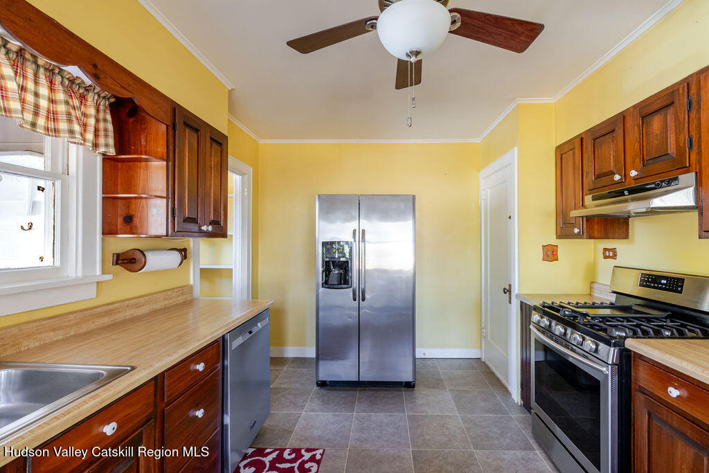 6 Hawley Road Niverville, NY 12130 - Photo 14 of 36 a kitchen with stainless steel appliances granite countertop a sink and cabinets
