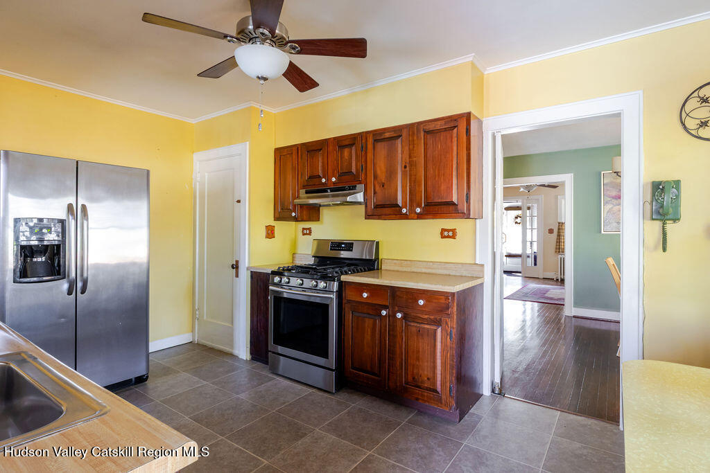 6 Hawley Road Niverville, NY 12130 - Photo 17 of 36 a kitchen with stainless steel appliances granite countertop a stove a refrigerator and a sink