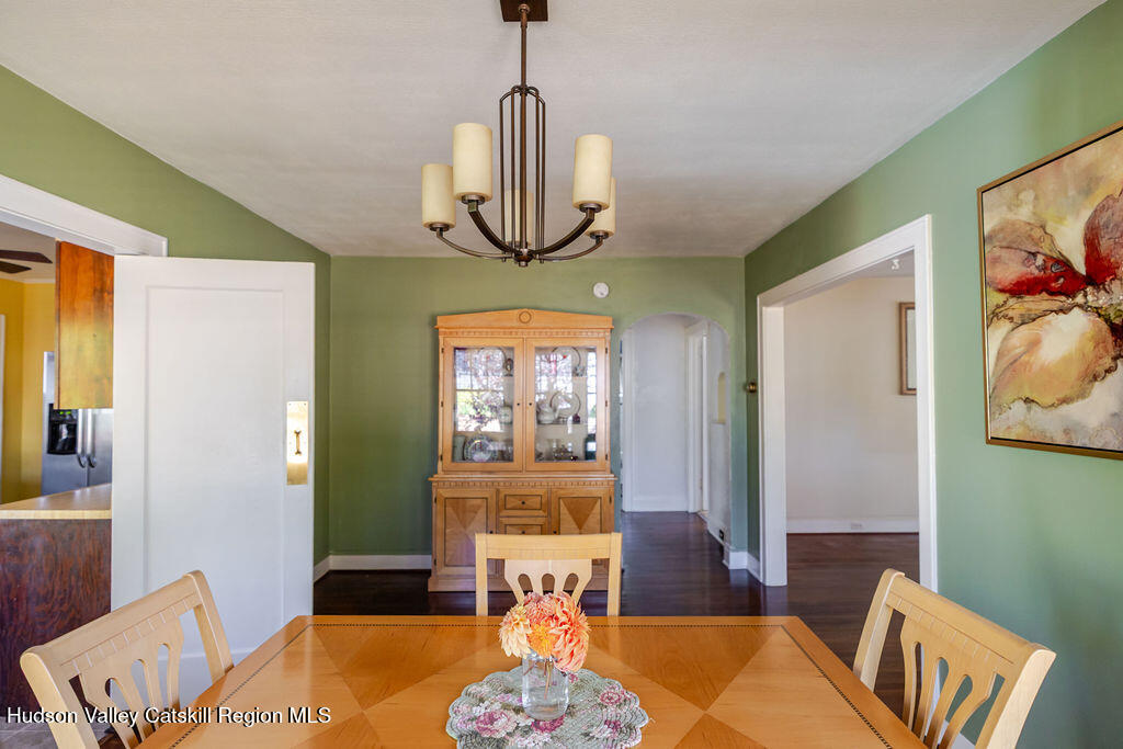 6 Hawley Road Niverville, NY 12130 - Photo 20 of 36 a living room with furniture and a chandelier