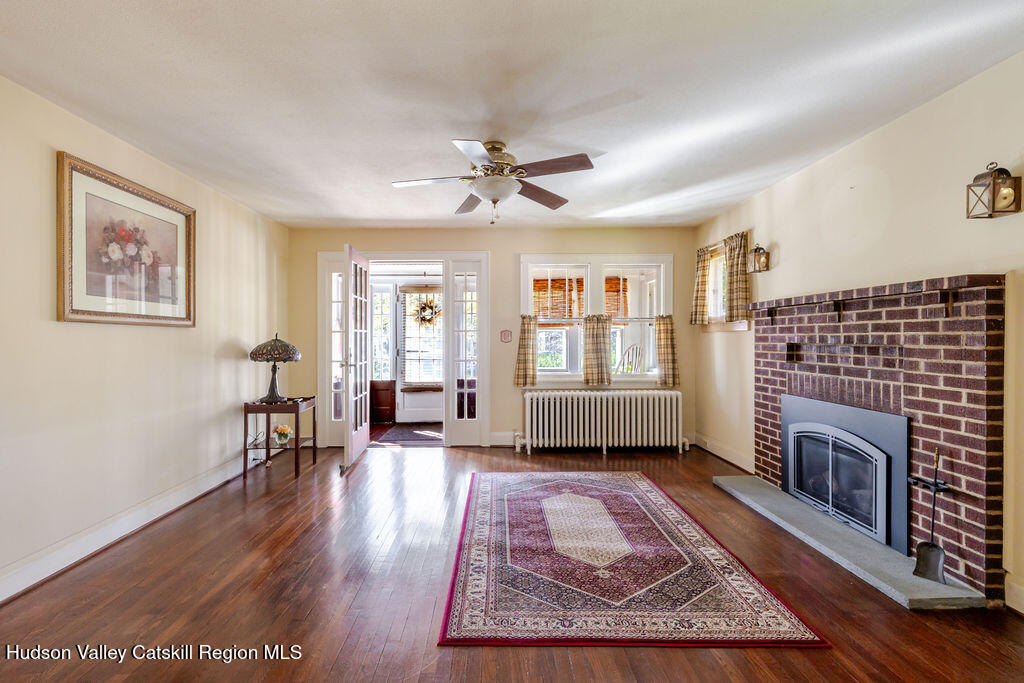 6 Hawley Road Niverville, NY 12130 - Photo 21 of 36 a living room with furniture and a fireplace