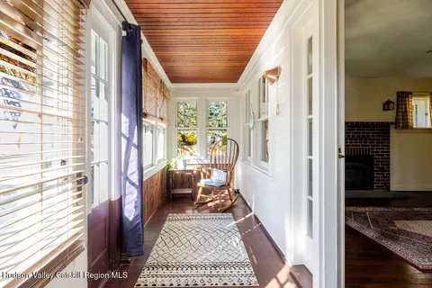 a view of living room with furniture and a rug