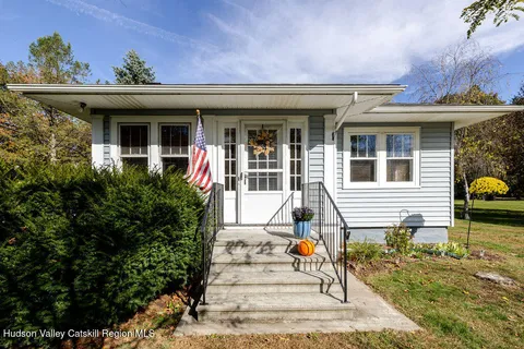 a front view of a house with a porch
