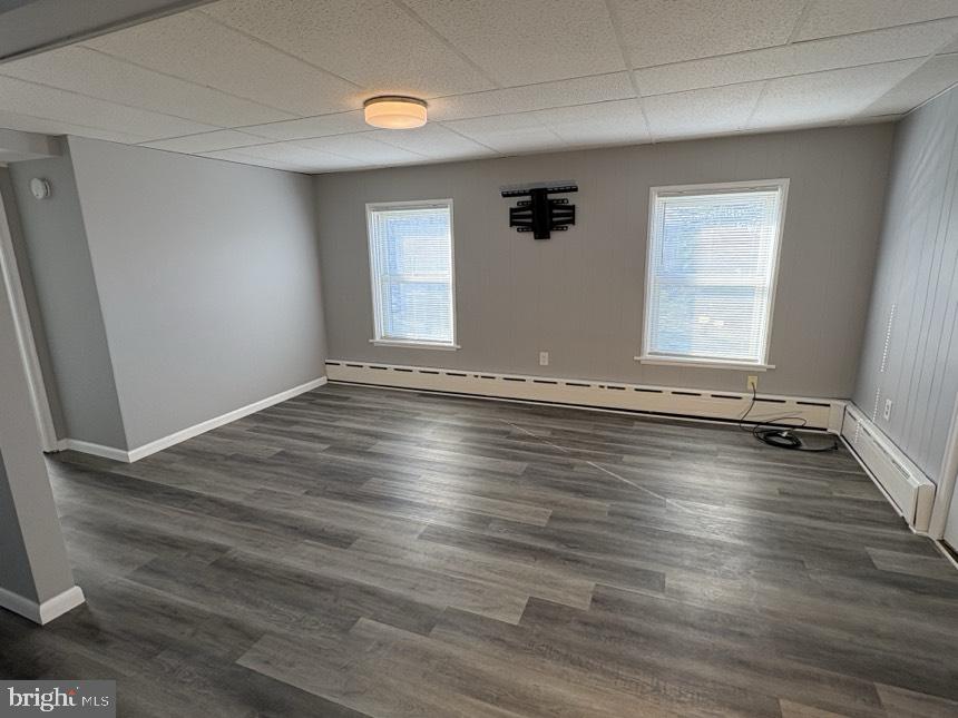 613 Laudermilch Road, Unit 2 Hummelstown, PA 17036 - Photo 14 of 16 an empty room with wooden floor and windows