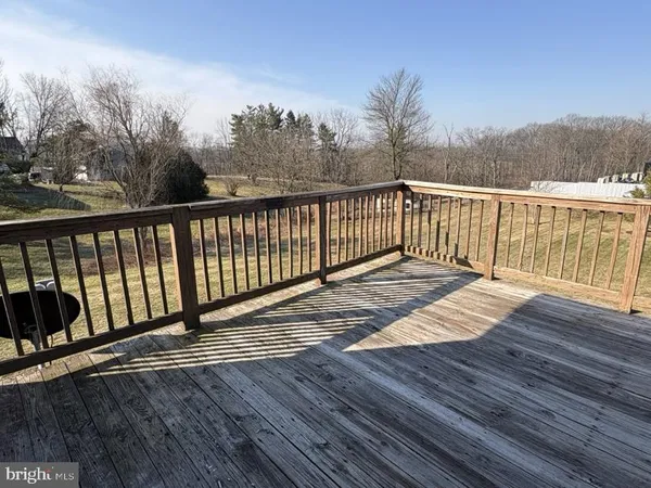 a balcony with view of wooden floor