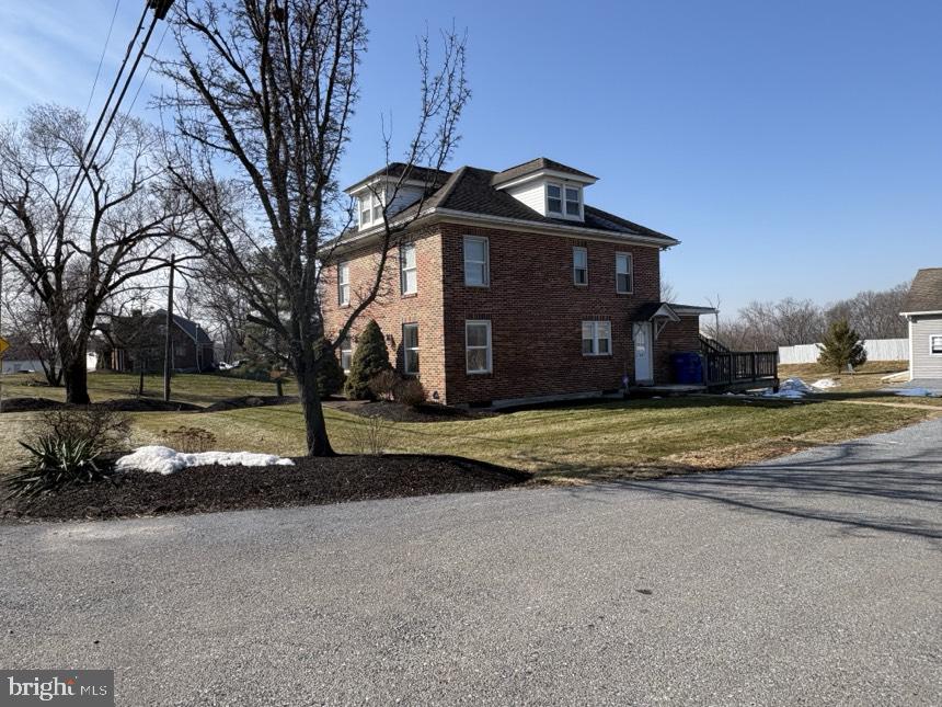 613 Laudermilch Road, Unit 2 Hummelstown, PA 17036 - Photo 2 of 16 a view of a house with a yard and large tree