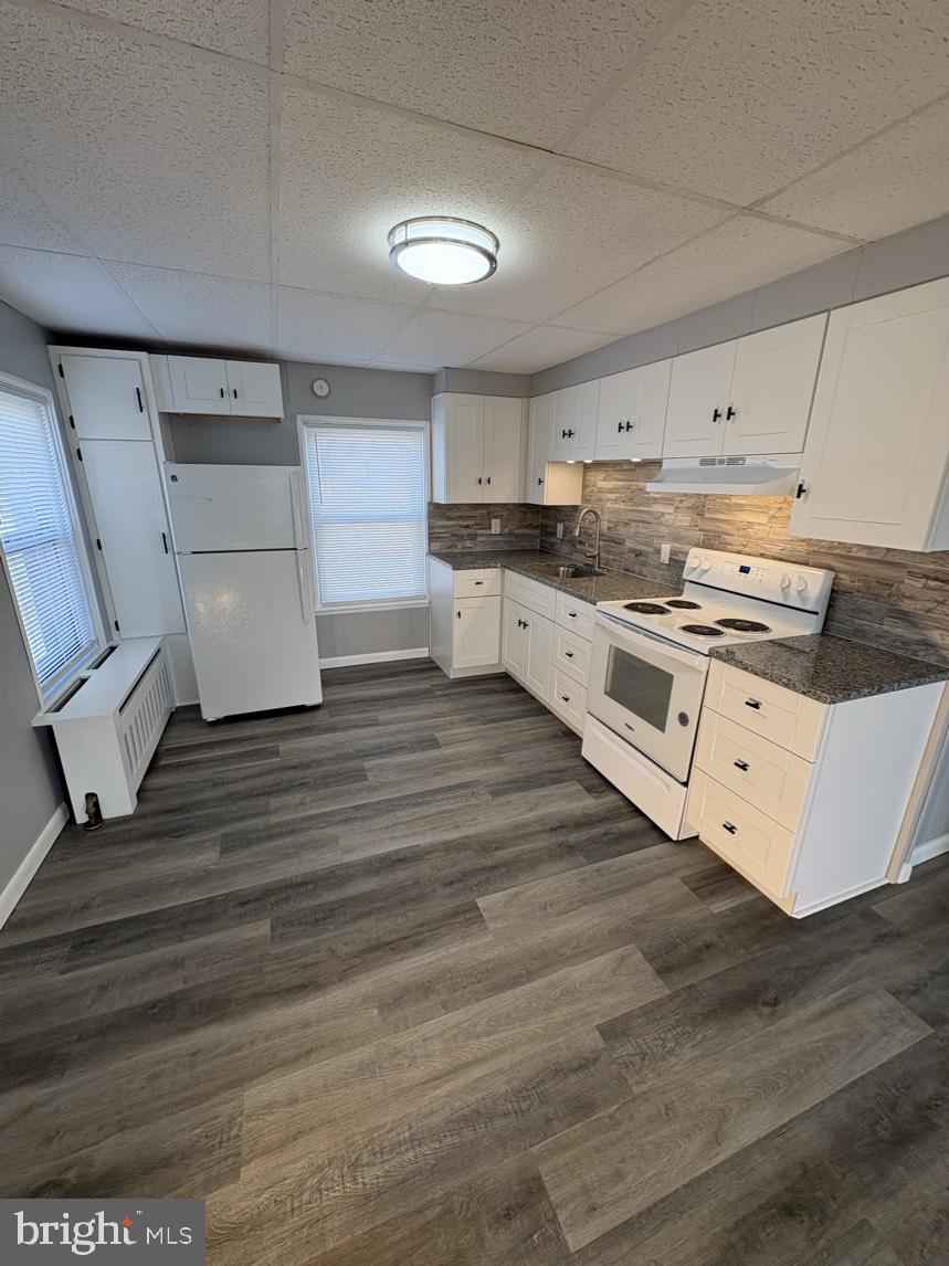 613 Laudermilch Road, Unit 2 Hummelstown, PA 17036 - Photo 5 of 16 a kitchen with stainless steel appliances granite countertop a stove and a refrigerator