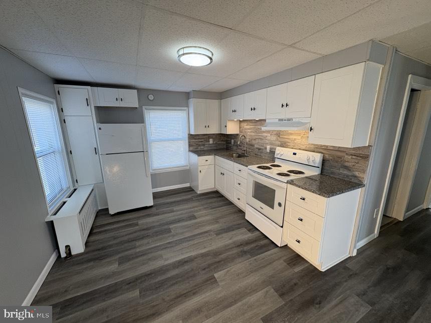 613 Laudermilch Road, Unit 2 Hummelstown, PA 17036 - Photo 6 of 16 a kitchen with stainless steel appliances a stove a refrigerator and cabinets