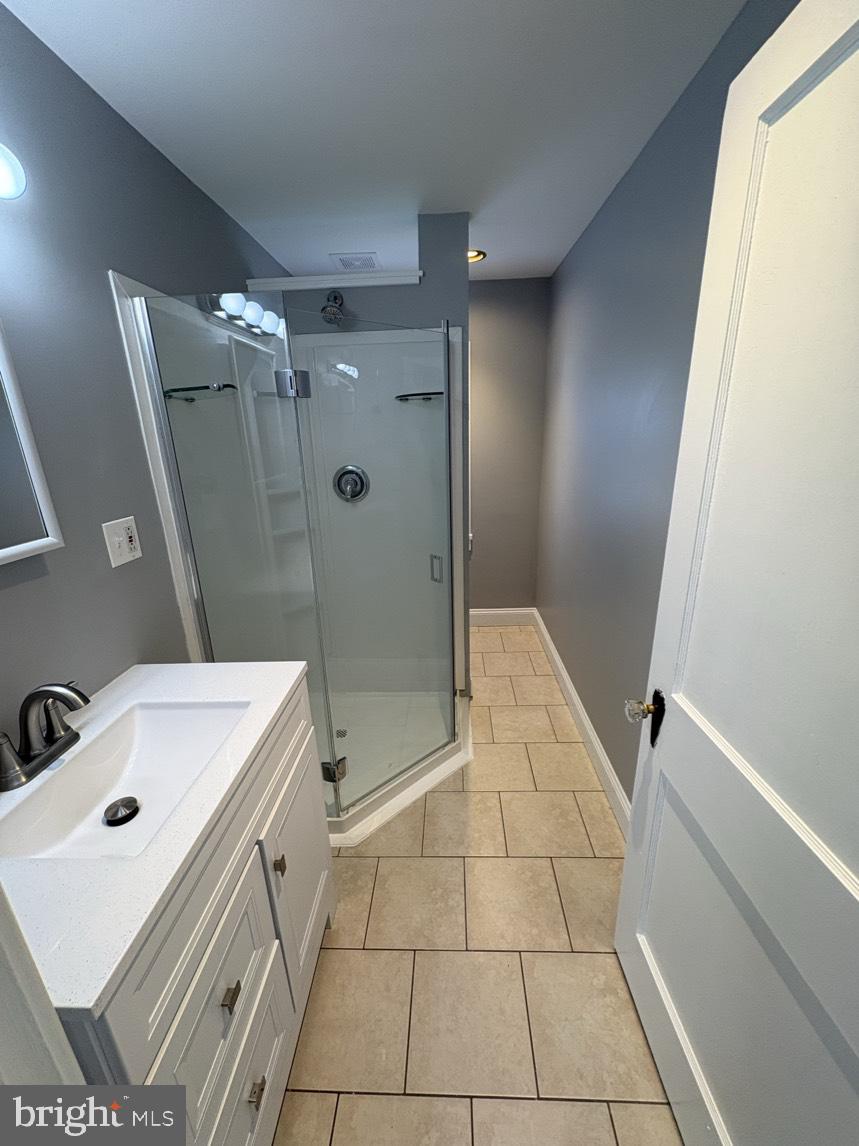 613 Laudermilch Road, Unit 2 Hummelstown, PA 17036 - Photo 7 of 16 a bathroom with a sink a toilet and shower