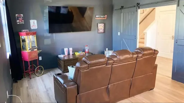 a bedroom with a bed and a couch