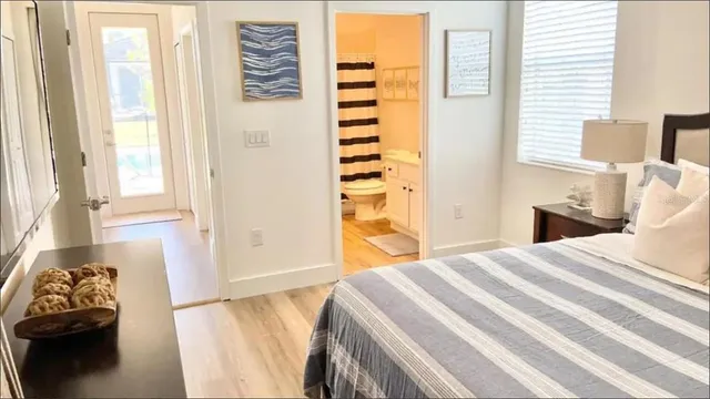 a bedroom with a bed and a window with outer view