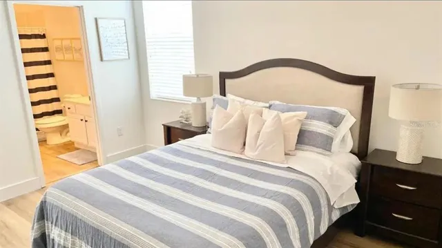 a bedroom with a bed and a couch