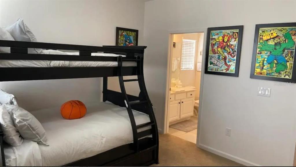2676 Calistoga Avenue Kissimmee, FL 34741 - Photo 20 of 30 a bedroom with a bed and a dresser