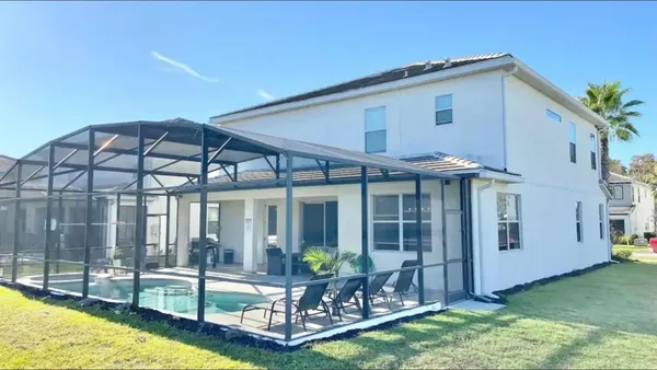 a view of a house with backyard porch and patio