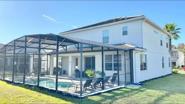 a view of a house with backyard porch and patio