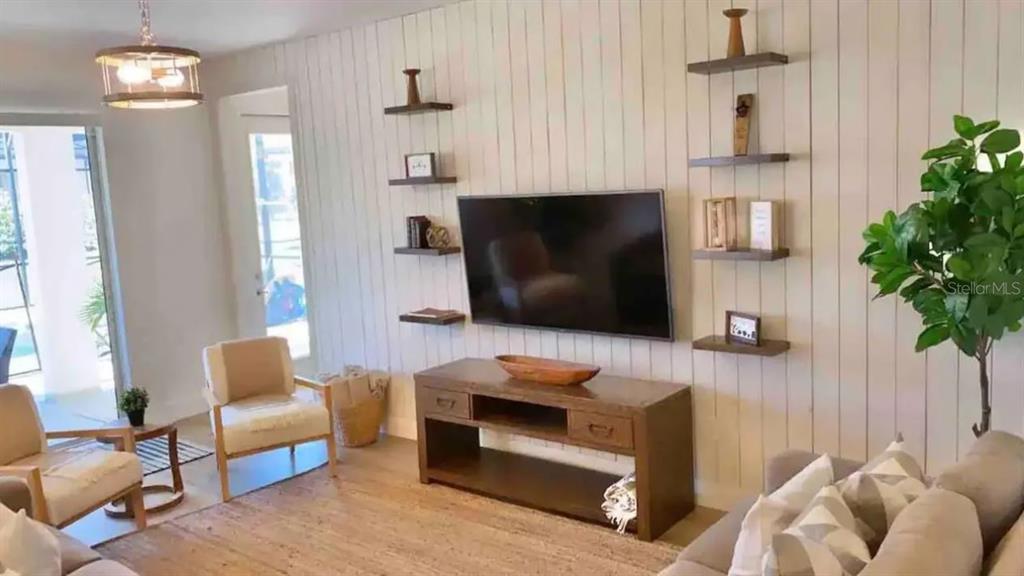 2676 Calistoga Avenue Kissimmee, FL 34741 - Photo 7 of 30 a living room with furniture and a fireplace