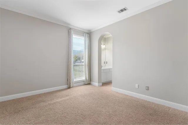 a view of an empty room and window