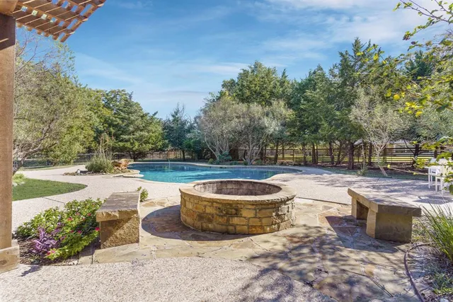 a view of a swimming pool with a patio