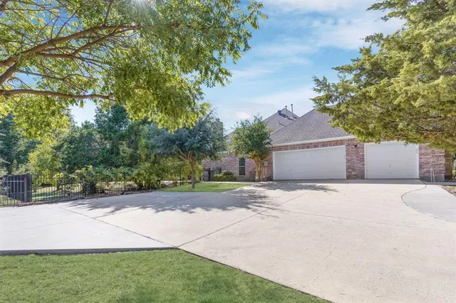 a front view of a house with a yard and a garage