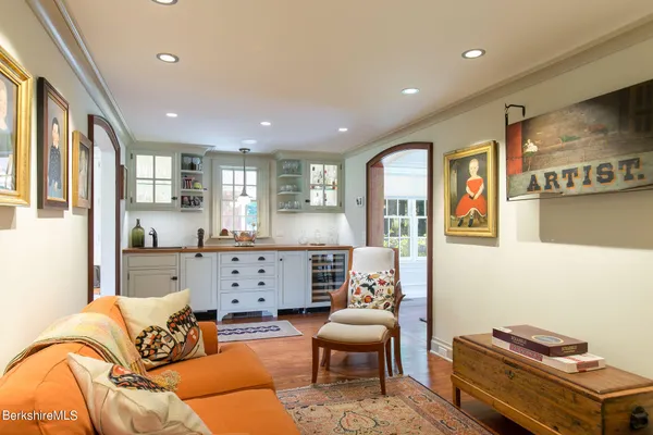 a living room with furniture and a rug
