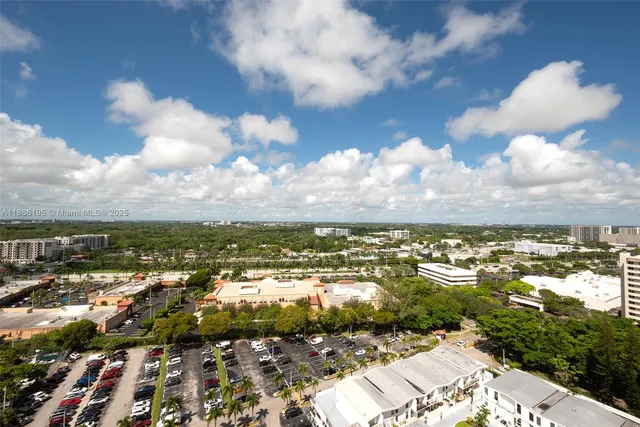an aerial view of residential building with yard