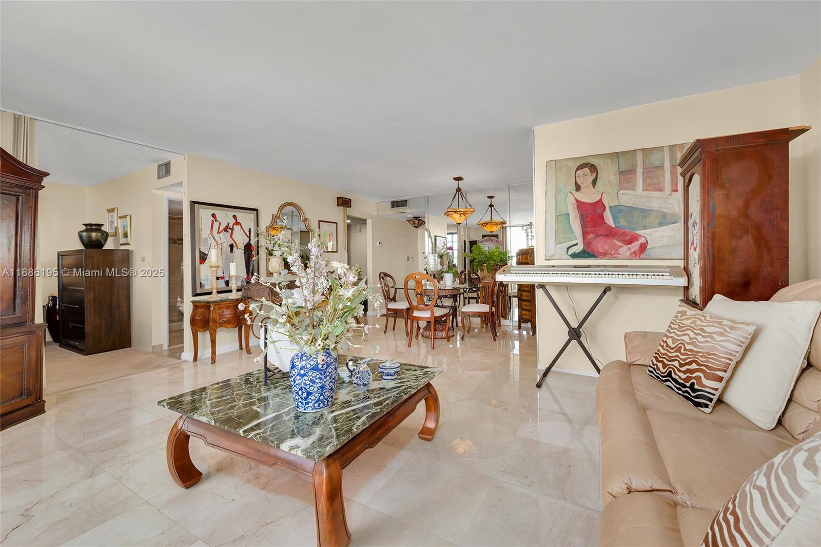 2750 Northeast 183rd Street, Unit 2204 Aventura, FL 33160 - Photo 21 of 31 a living room with furniture and wooden floor