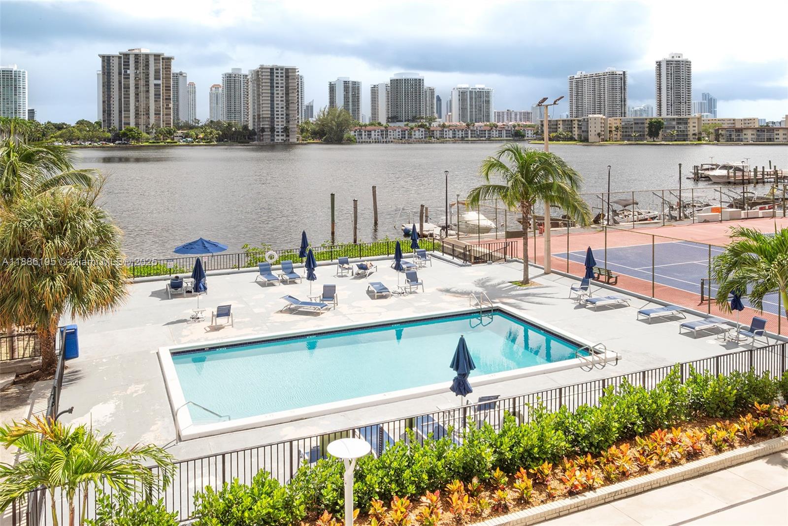 2750 Northeast 183rd Street, Unit 2204 Aventura, FL 33160 - Photo 26 of 31 a view of lake with residential building and outdoor space