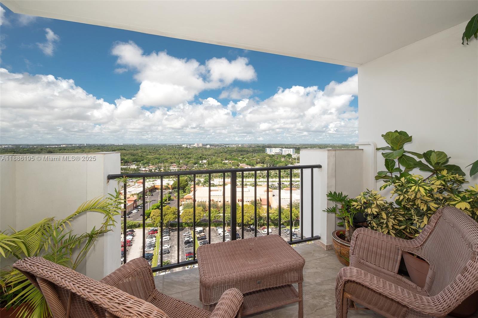 2750 Northeast 183rd Street, Unit 2204 Aventura, FL 33160 - Photo 3 of 31 a balcony with furniture and a potted plant