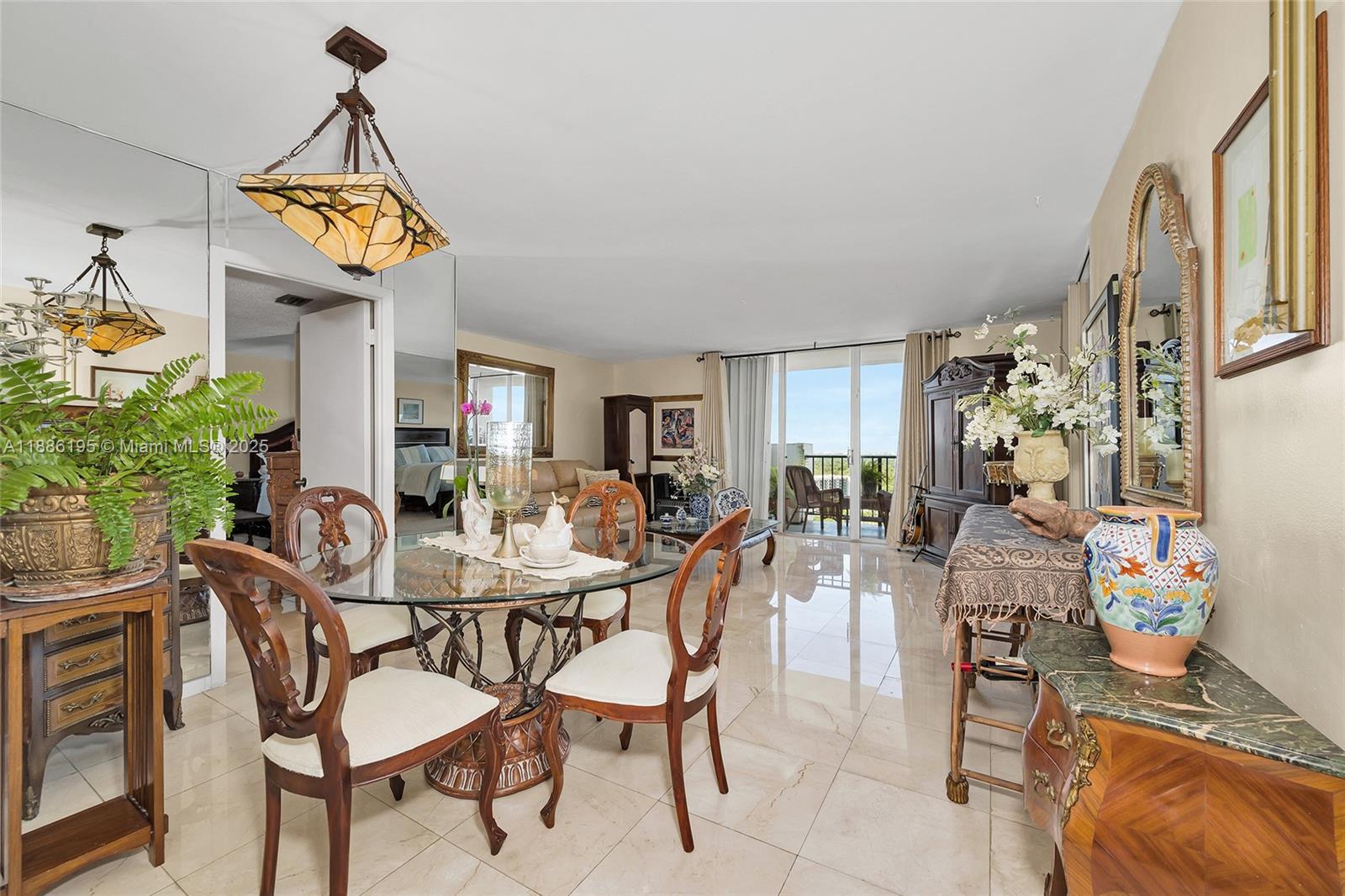 2750 Northeast 183rd Street, Unit 2204 Aventura, FL 33160 - Photo 5 of 31 a view of a dining room with furniture and a chandelier