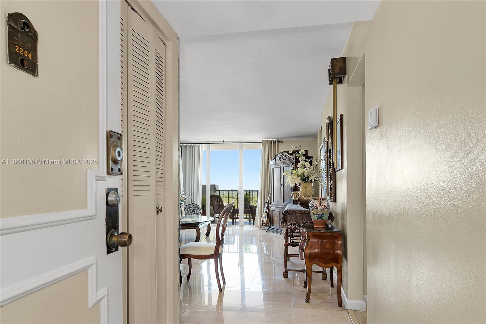 2750 Northeast 183rd Street, Unit 2204 Aventura, FL 33160 - Photo 7 of 31 a view of a livingroom with furniture and a window