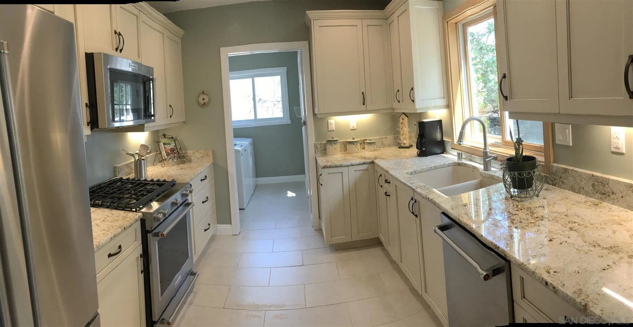 2181 Wynola Road Julian, CA 92036 - Photo 8 of 25 a kitchen with granite countertop a sink stove and refrigerator