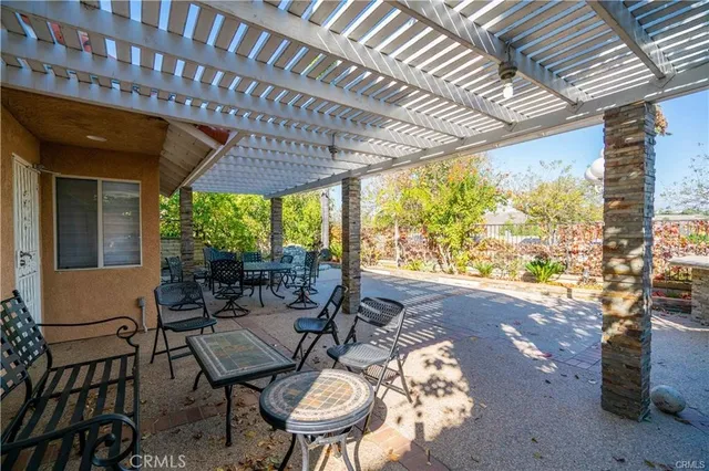a outdoor dining space with furniture and outdoor view