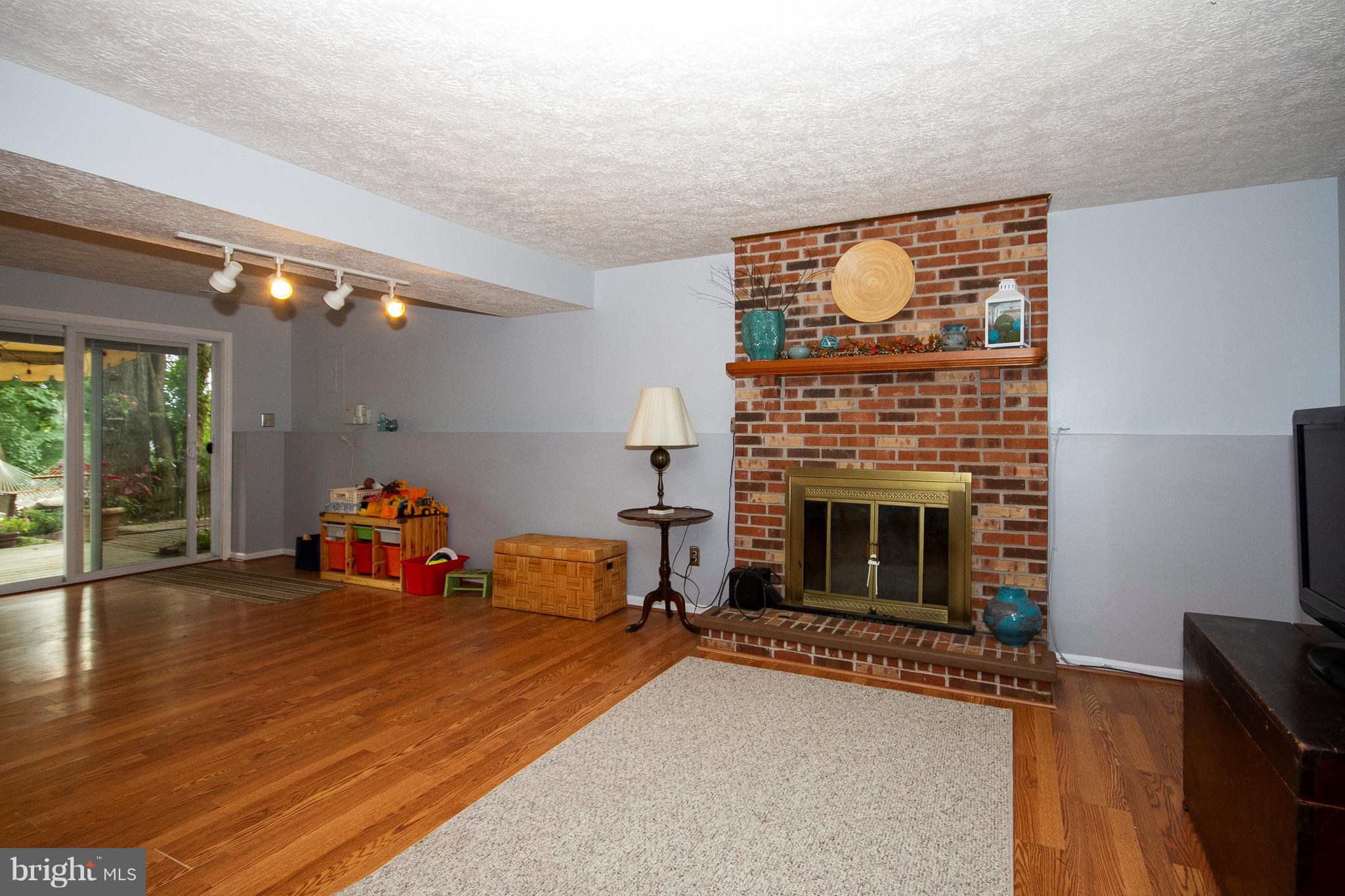 9513 Hallhurst Road Baltimore, MD 21236 - Photo 22 of 30 a view of a livingroom with furniture and a fireplace