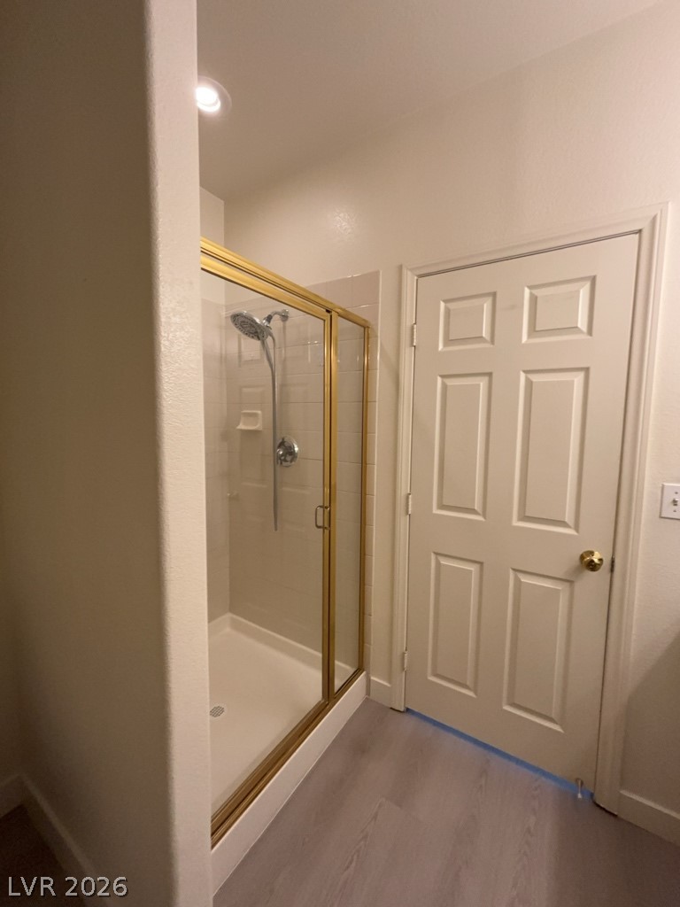 4915 East Russell Road, Unit 147 Las Vegas, NV 89120 - Photo 10 of 14 Bathroom with a stall shower and light wood-style floors
