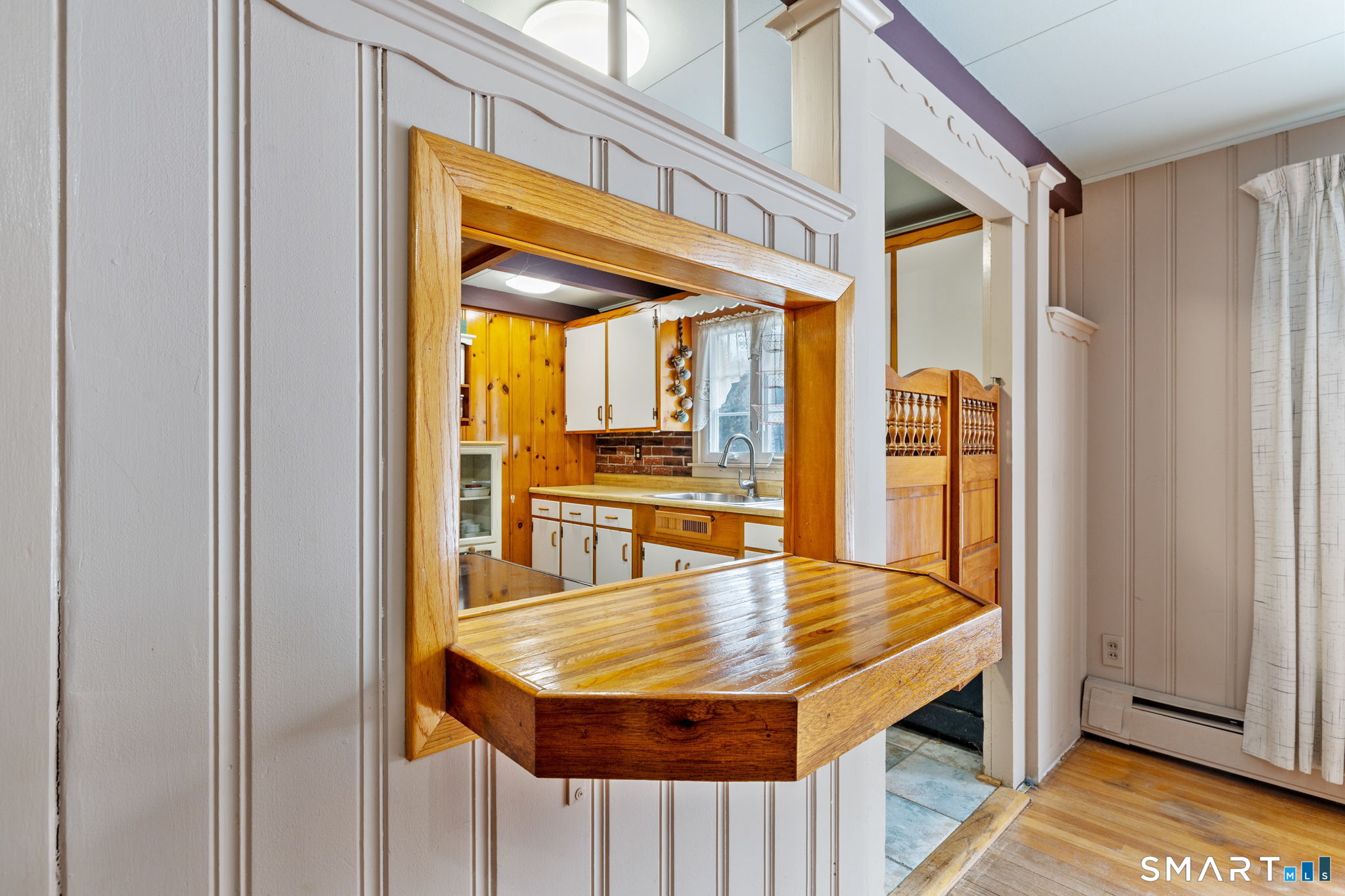 52 North Glenwoods Road Ledyard, CT 06335 - Photo 12 of 27 a view of kitchen island with furniture and wooden floor