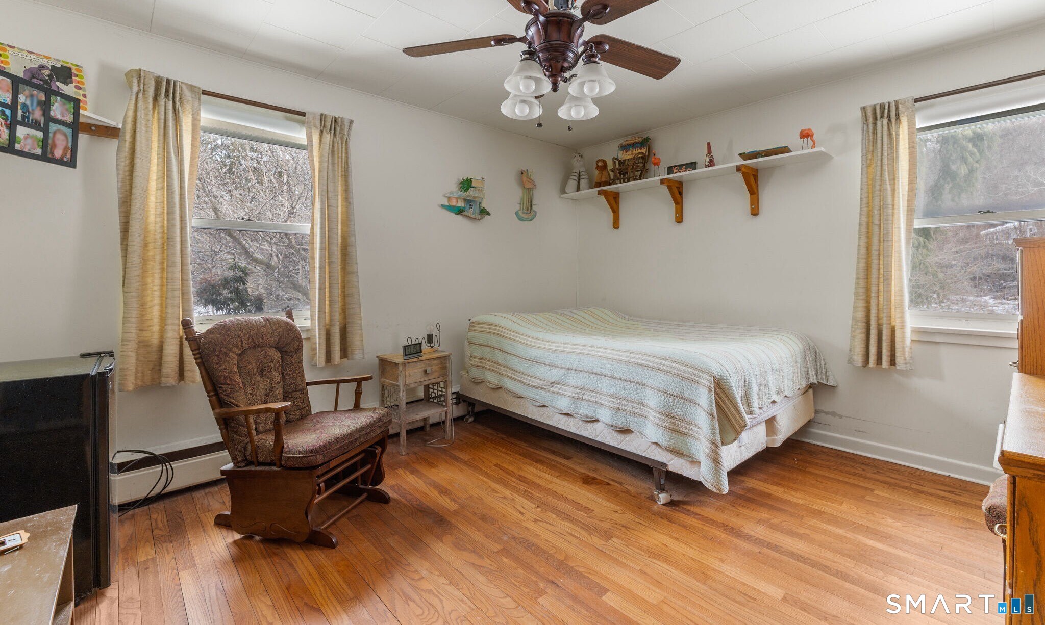 52 North Glenwoods Road Ledyard, CT 06335 - Photo 14 of 27 a bedroom with a bed chairs and a window