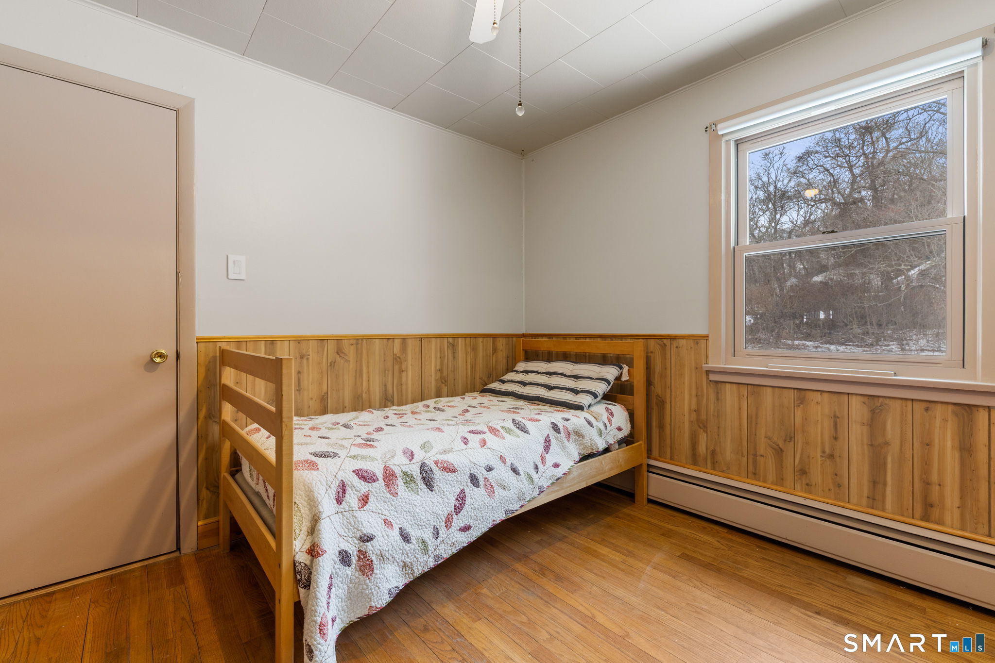 52 North Glenwoods Road Ledyard, CT 06335 - Photo 18 of 27 a bedroom with a bed and wooden floor