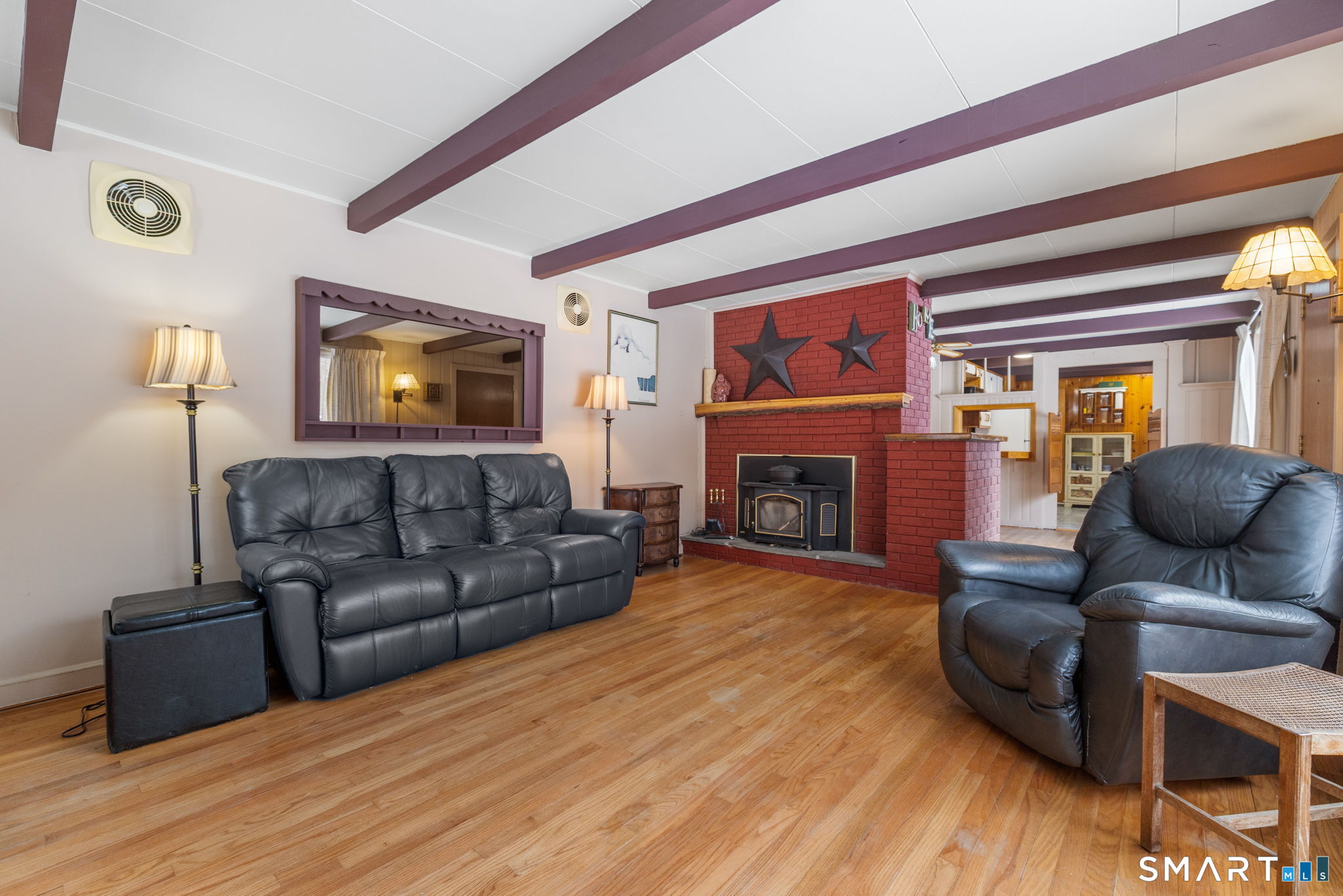 52 North Glenwoods Road Ledyard, CT 06335 - Photo 6 of 27 a living room with furniture and a fireplace