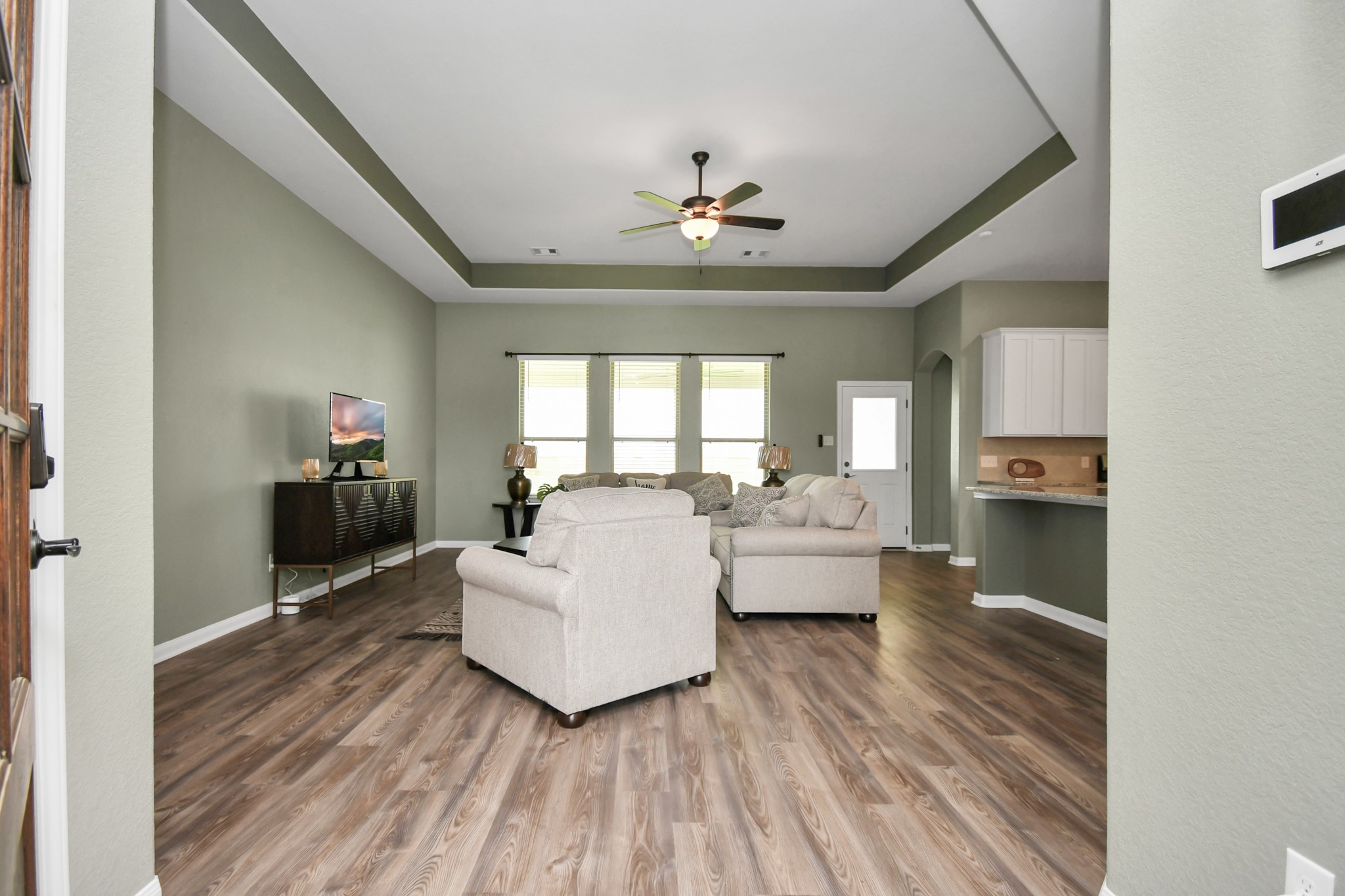395 Hunter Ranch Way Dayton, TX 77535 - Photo 3 of 11 Open concept living area with high ceilings and abundant natural light