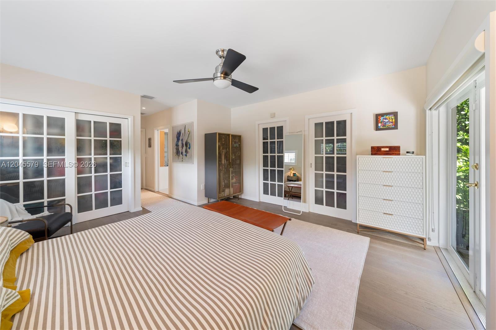 12944 Banyan Road North Miami, FL 33181 - Photo 13 of 26 a bedroom with a bed closet and window
